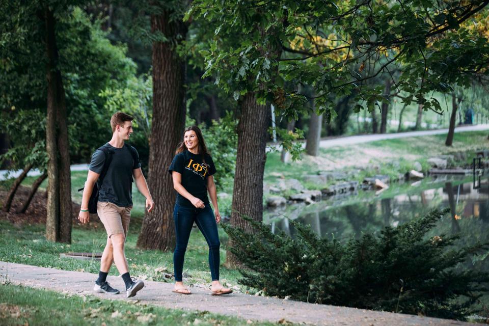 Students walking by water