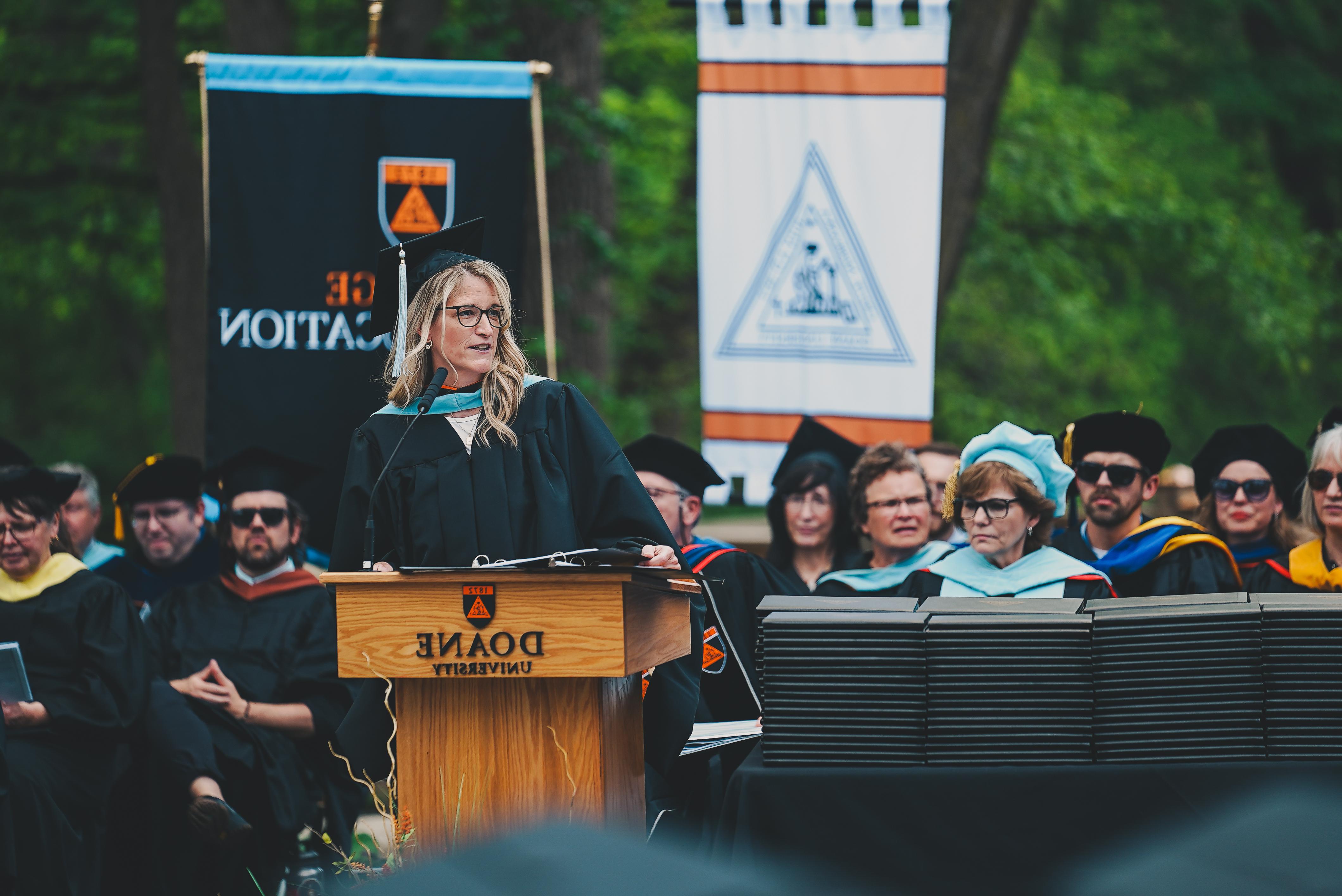 Lisa Slaughter Fye ’97, ’01E, ’10E gives the commencement ceremony speech in Cassel on May 13, 2023